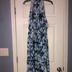 Long flowy dress with floral pattern.